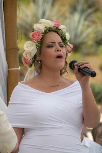 A bride singing at her wedding ceremony