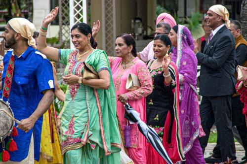 Indian girls waving hands in route to the Wedding Ceremony